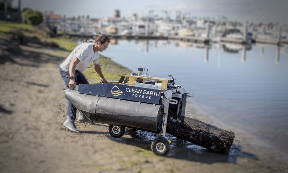 A University of Cincinnati student uses a UC-Designed tool to clean up waterways